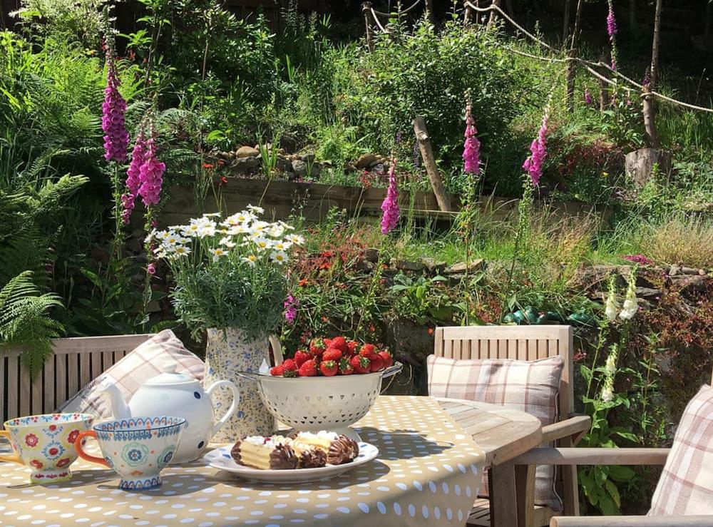 Enjoy a cream tea in the garden at Birkenhead Cottage in Hebden Bridge, Yorkshire, West Yorkshire