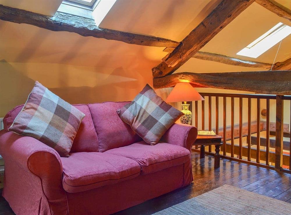 Comfortable sofa on the galleried landing at Birkerthwaite Barn in Eskdale, Cumbria