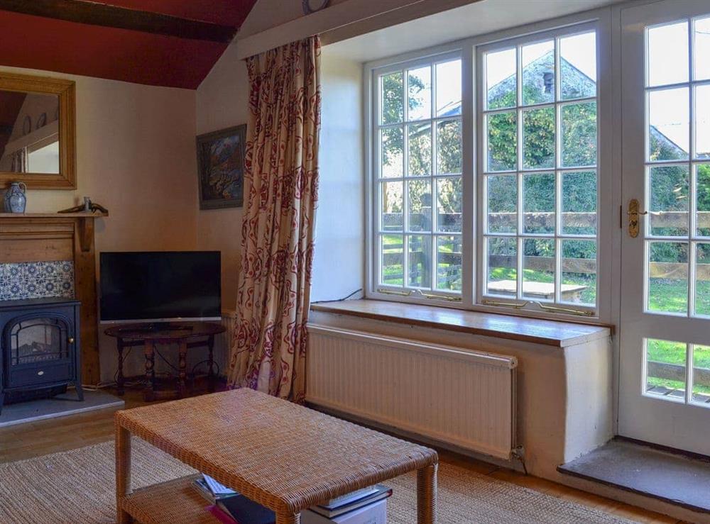 Light and bright living space with garden access at Birkerthwaite Cottage in Eskdale, Cumbria