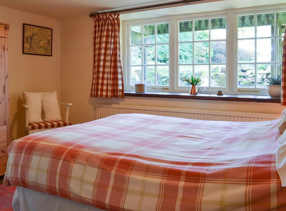 Warm and welcoming double bedroom at Birkerthwaite Cottage in Eskdale, Cumbria