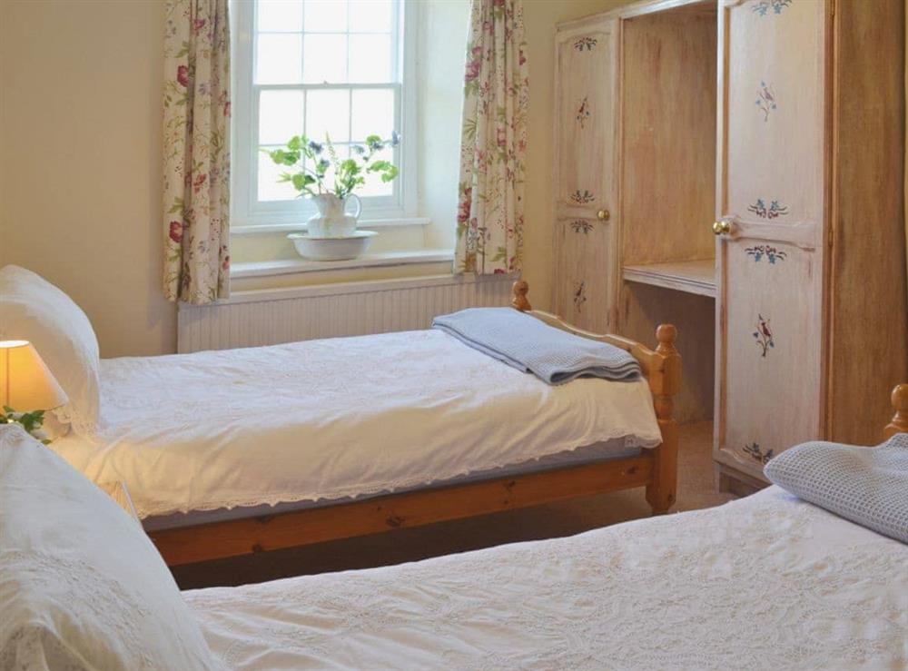 Twin bedroom at Birkerthwaite Farmhouse in Birker Fell, near Eskdale, Cumbria