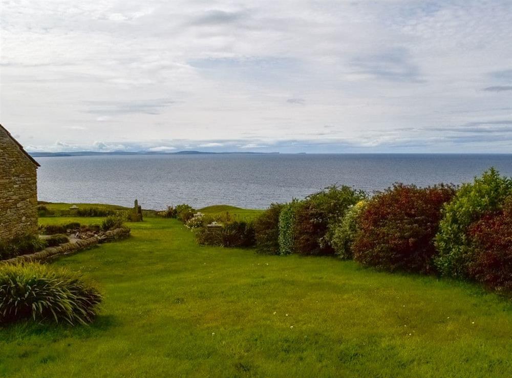Well-maintained gardens and sea view at Fisherman’s Cove, 