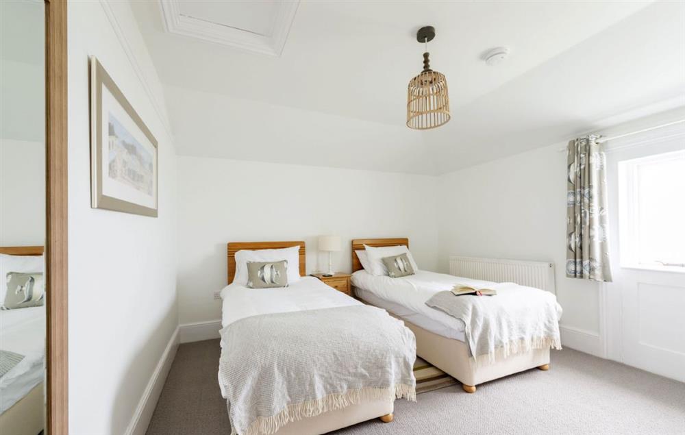 Bedroom with twin 3’ single beds and sea views at Bishop Rock, The Lizard