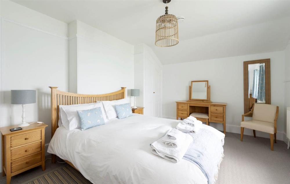 Double bedroom with 5’ king-size bed and sea views at Bishop Rock, The Lizard