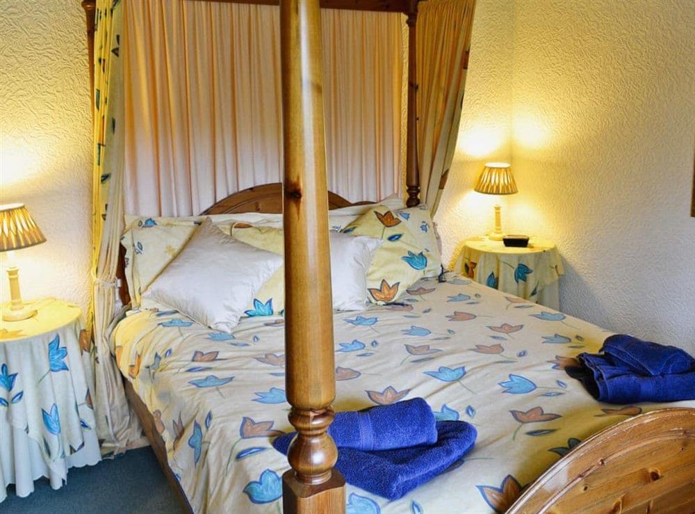Four Poster bedroom at Black Combe Apartment in Ambleside, Cumbria
