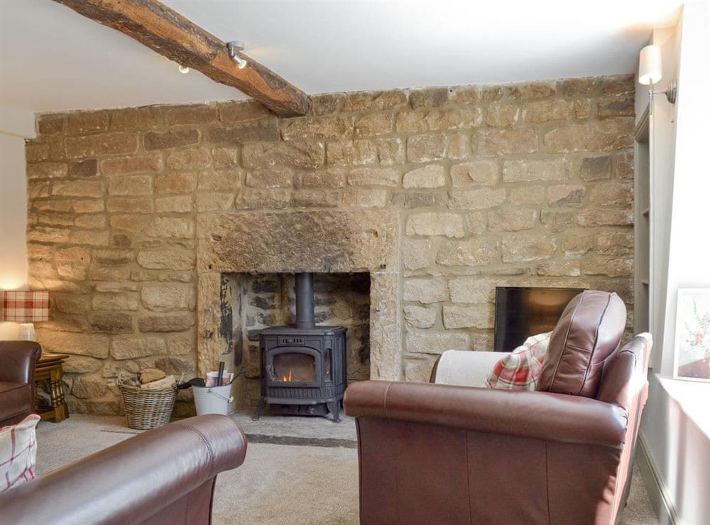Characterful living room at Blackcurrant Cottage at Stanton Ford Farm in Baslow, near Bakewell, Derbyshire