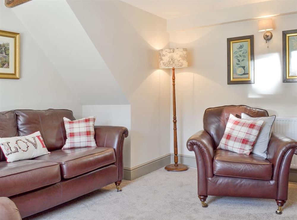 Comfy seating within living room at Blackcurrant Cottage at Stanton Ford Farm in Baslow, near Bakewell, Derbyshire