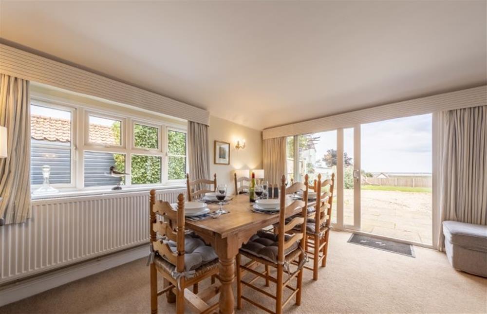 The dining area with a view at Blackhorse Cottage, Brancaster Staithe near Kings Lynn