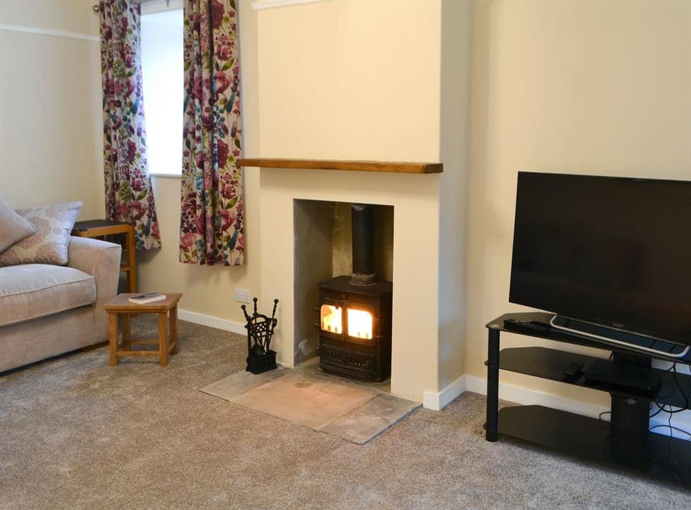 Cosy Living room with wood burner at Blackpool Farm Cottage in Longhorsley, near Morpeth, Northumberland