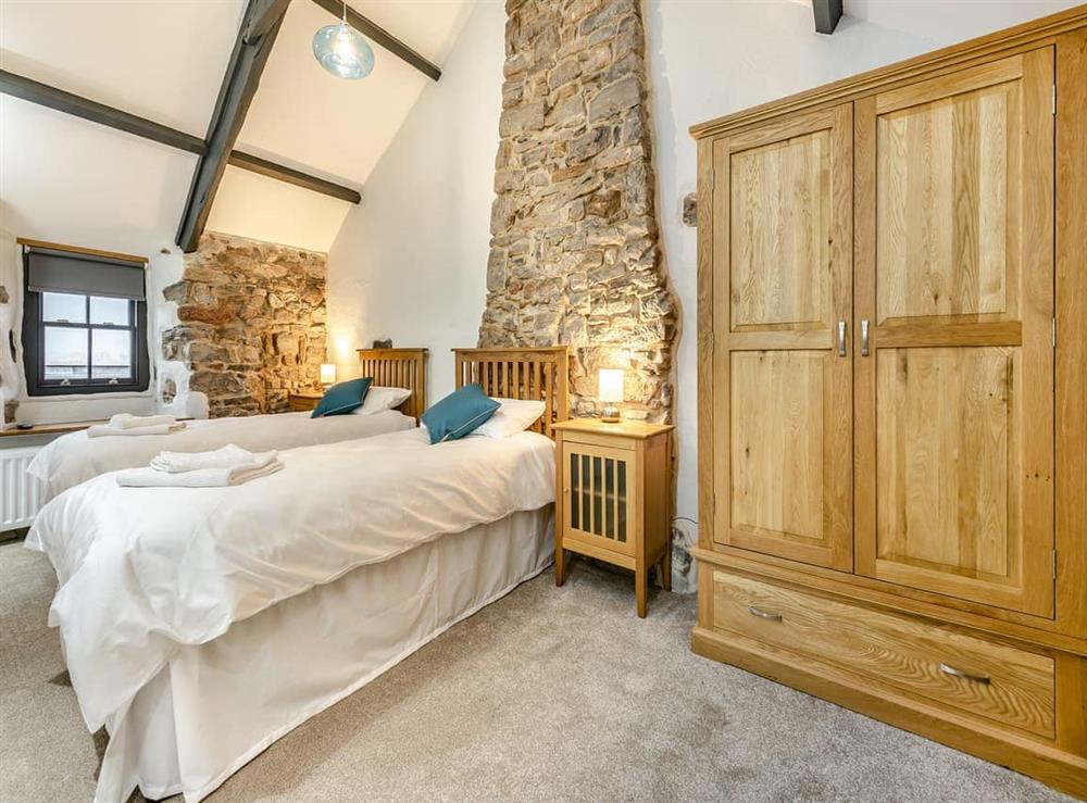 Twin bedroom at Blacksmiths Cottage in Pembroke, Dyfed