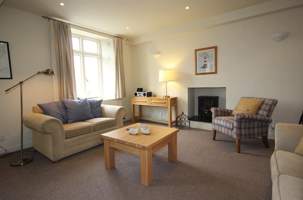 Sitting room with comfortable seating for six at Blackstone Cottage in Devon Road, Salcombe