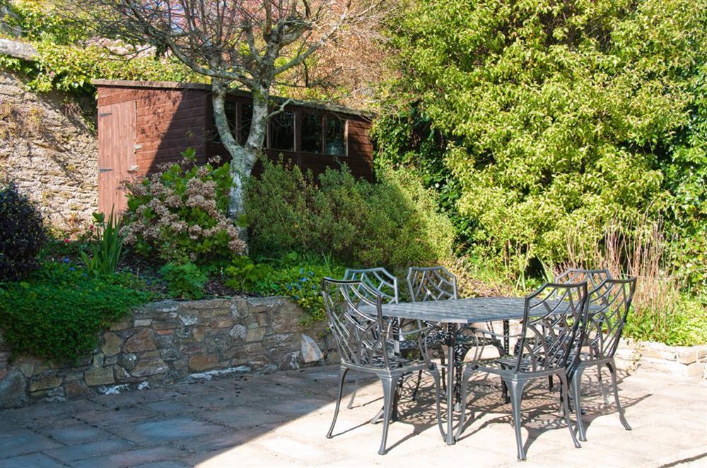 South facing sun terrace with table and chairs at Blackstone Cottage in Devon Road, Salcombe