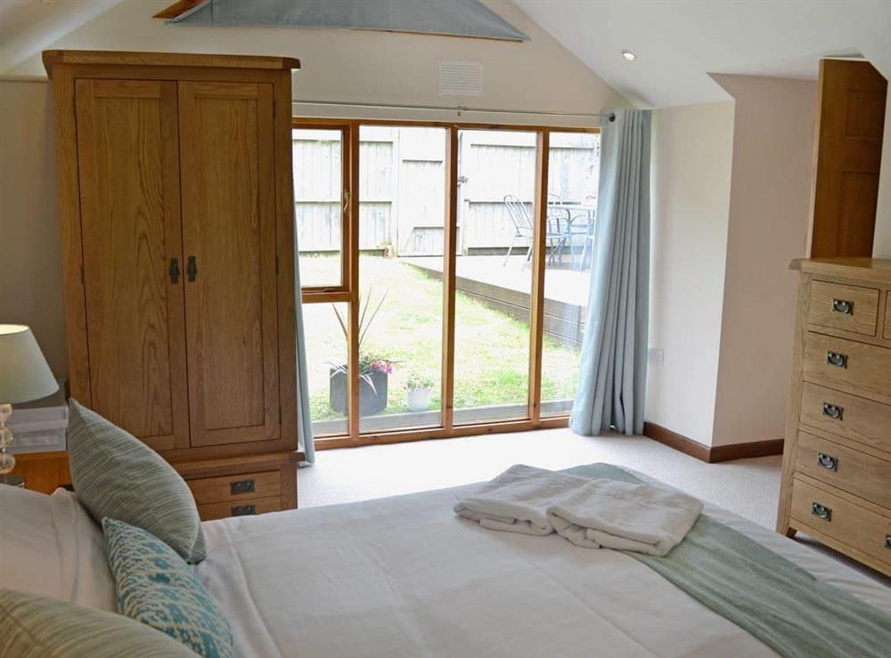 Beautifully decorated double bedroom with en-suite shower cubicle (photo 2) at Blackthorn Cottage in Swan Pool, near Falmouth, Cornwall
