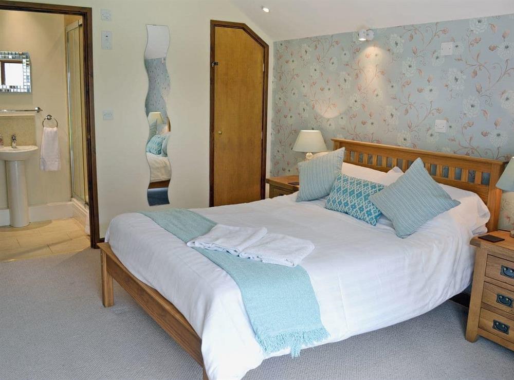 Beautifully decorated double bedroom with en-suite shower cubicle at Blackthorn Cottage in Swan Pool, near Falmouth, Cornwall
