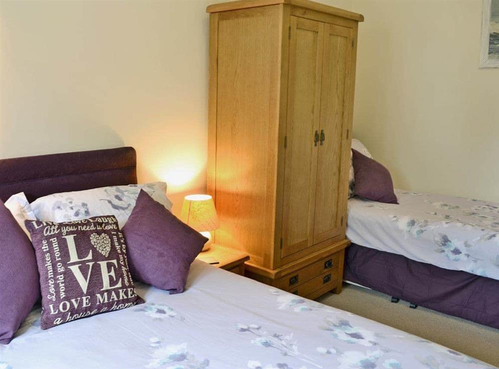 Comfortable bedroom with double bed and single bed (photo 2) at Blackthorn Cottage in Swan Pool, near Falmouth, Cornwall