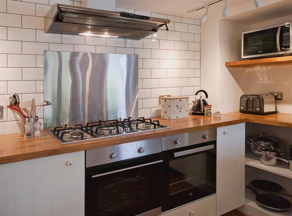 Contemporary tiled kitchen with a traditional feel at Cherry Cottage, 