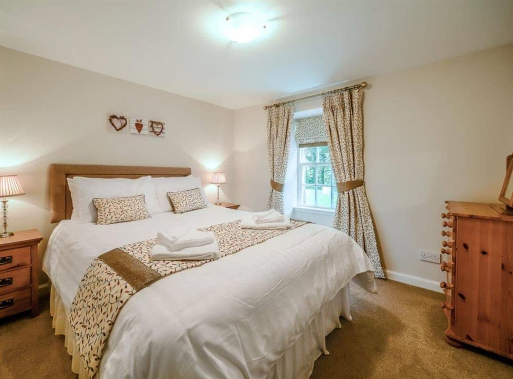 Comfortable double bedroom at Cunninghame Cottage, 