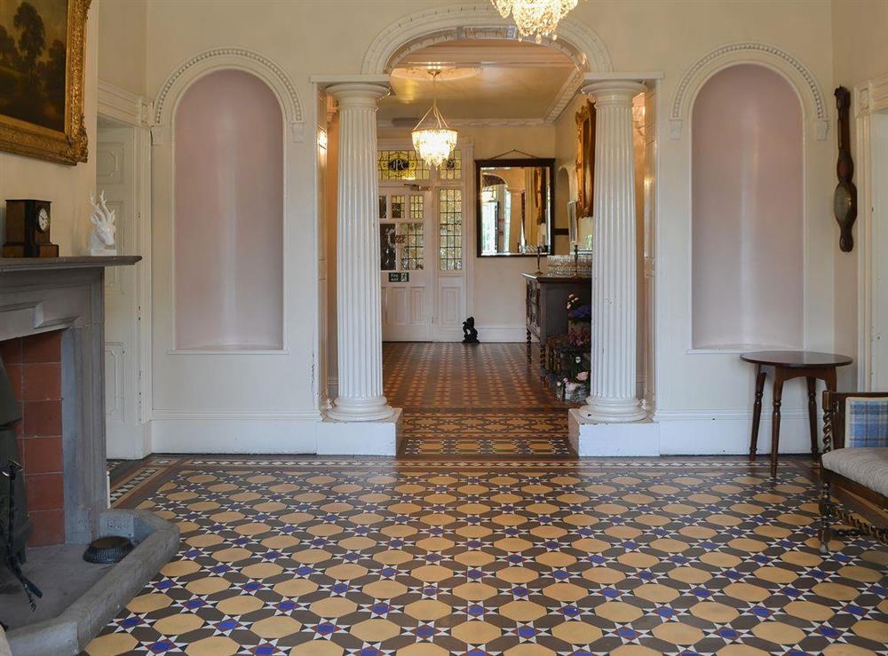 Beautifully tiled formal hallway with woodburner at Blaithwaite House, 