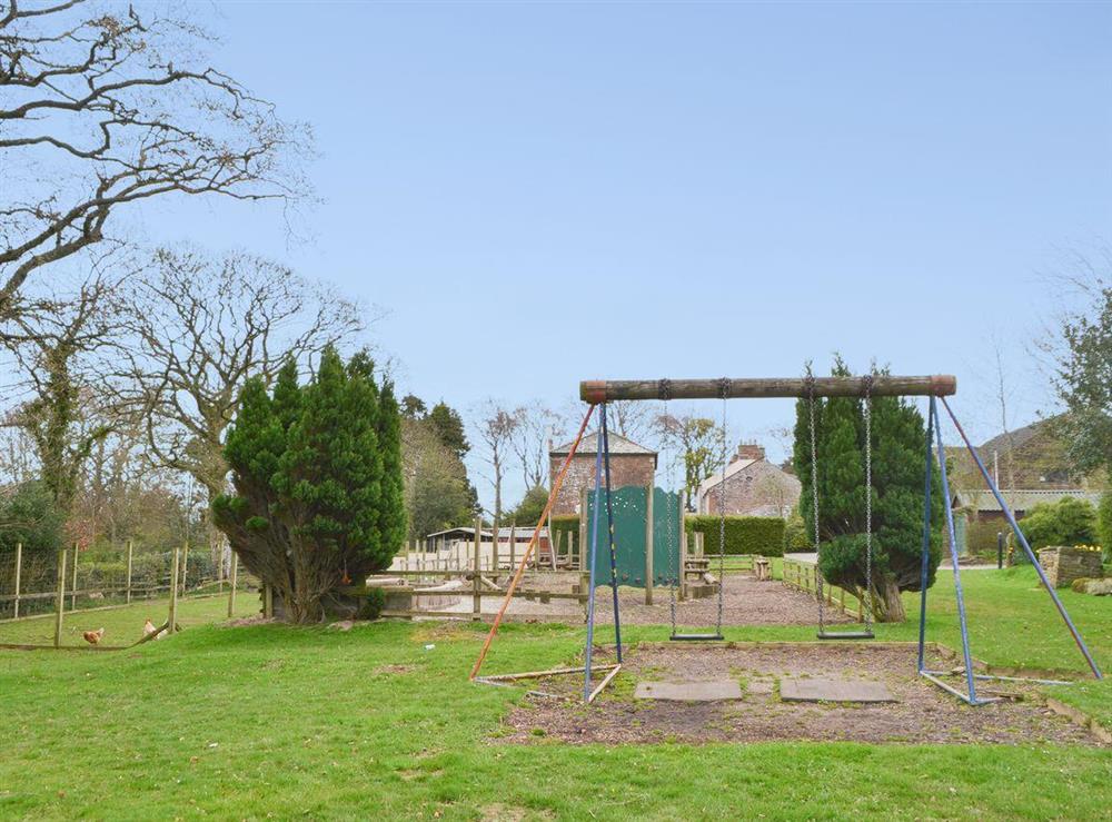 Children’s play area and adjacent chicken and goat pens at Blaithwaite House, 