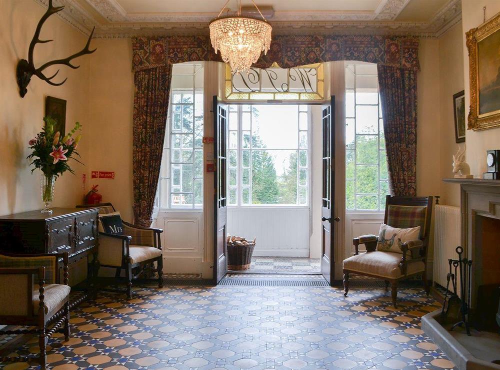 Grand hallway with chandelier at Blaithwaite House, 