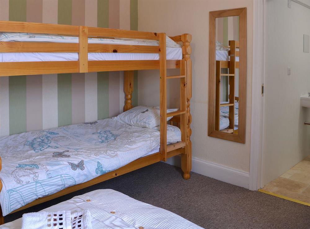 Double bedroom with additional bunk beds and en-suite at Blaithwaite Stables, 