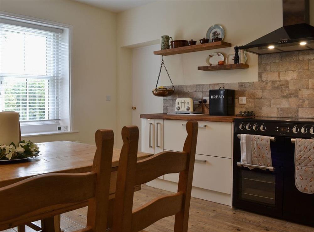 Kitchen with dining area at Bridge Cottage, 