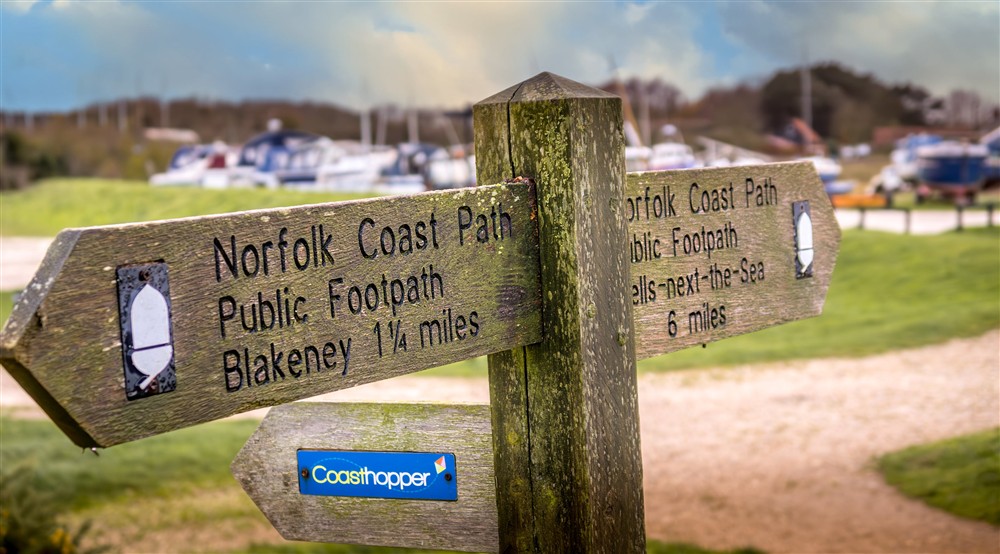 A sign for footpaths near Blakeney Lodge, Norfolk at Blakeney Lodge in Blakeney, Norfolk