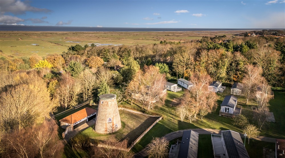 An aerial view of Blakeney Lodge and its walled garden, next to the private static caravans at Blakeney Lodge in Blakeney, Norfolk