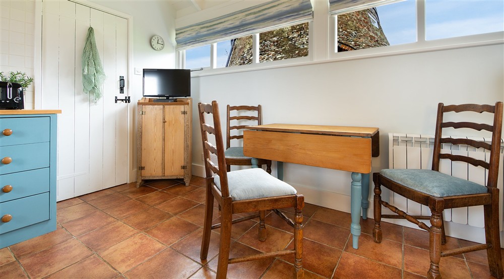 The dining area in the open-plan living space at Blakeney Lodge in Blakeney, Norfolk