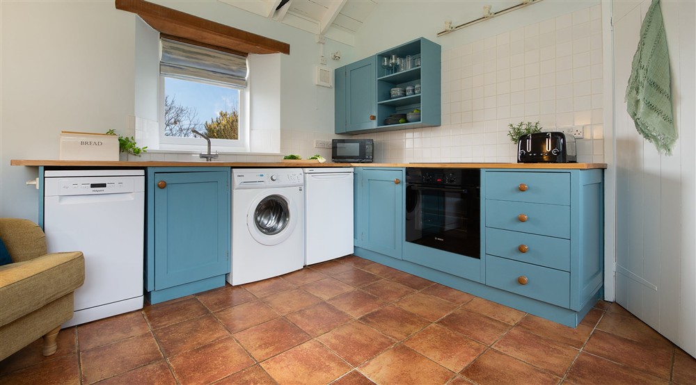 The kitchen area in the open-plan living space at Blakeney Lodge in Blakeney, Norfolk