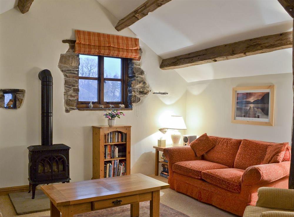 Delightful living area with wood-burner and heritage features at Blencathra in Penrith, Cumbria