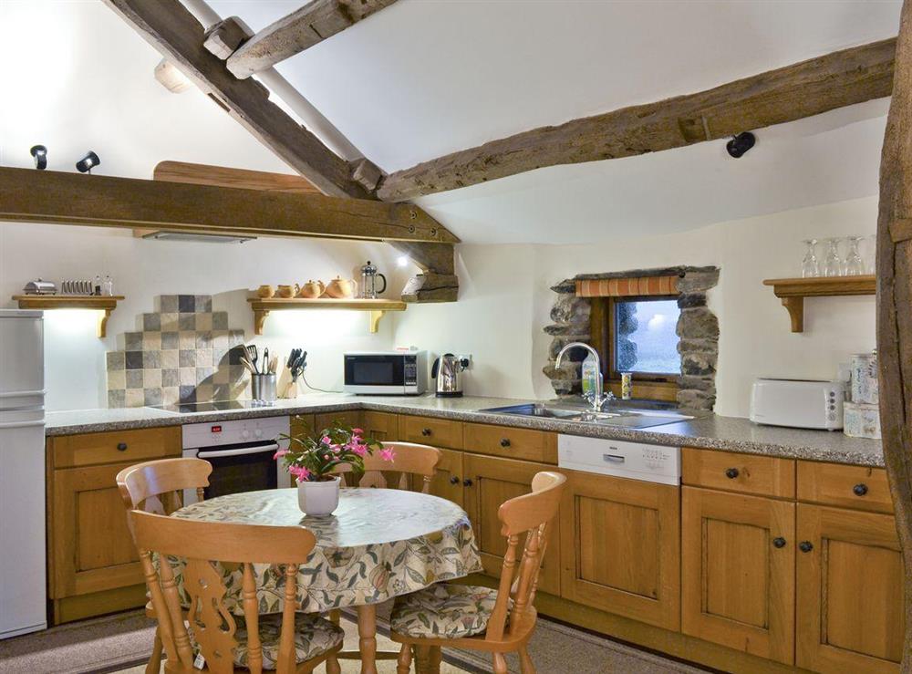 Spacious kitchen and dining area with oak frame features at Blencathra in Penrith, Cumbria