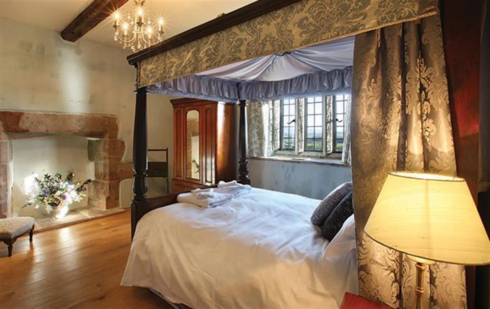 Accessed by a spiral staircase leading to the North Tower: The North Tower Master Bedroom (5’ four poster bed) with en suite bathroom with a separate shower and a vanity unit