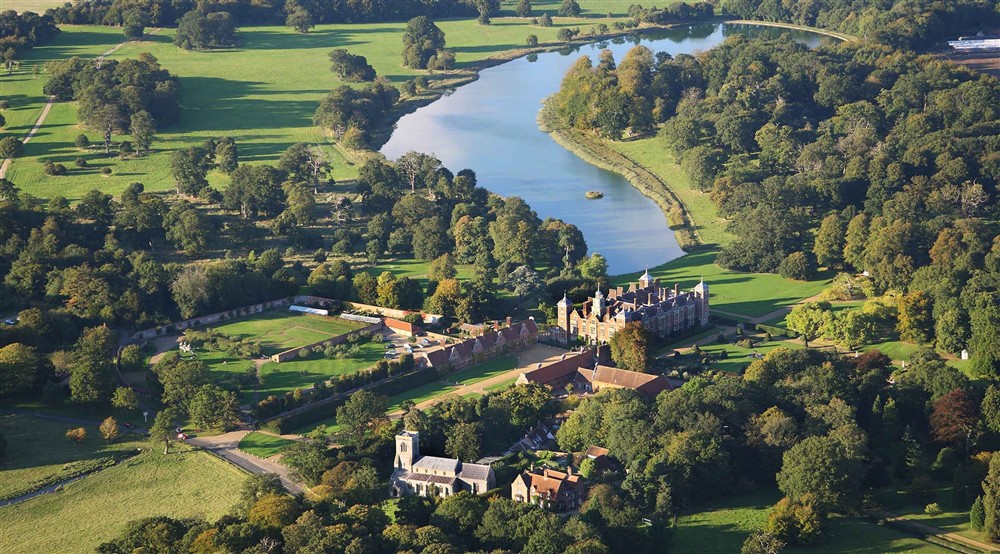 Aerial view of Blickling Estate in Norfolk showing the house, grounds and lake at Blickling Dairy House in Blicking, Norfolk