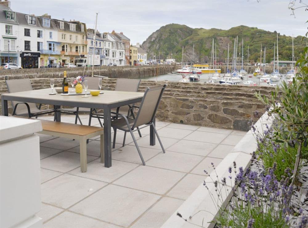 Enclosed private patio overlooking the harbour at Blue Beach House in Ilfracombe, Devon