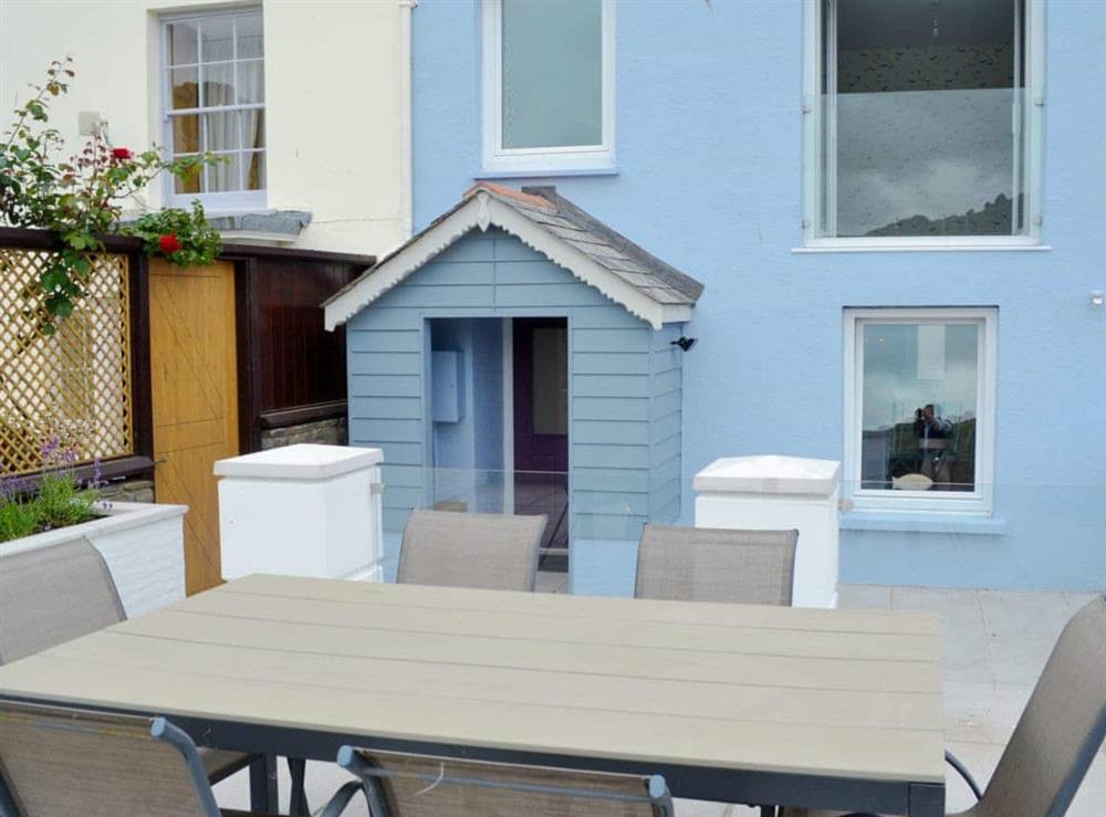 Lovely holiday home with outdoor furniture on private patio at Blue Beach House in Ilfracombe, Devon