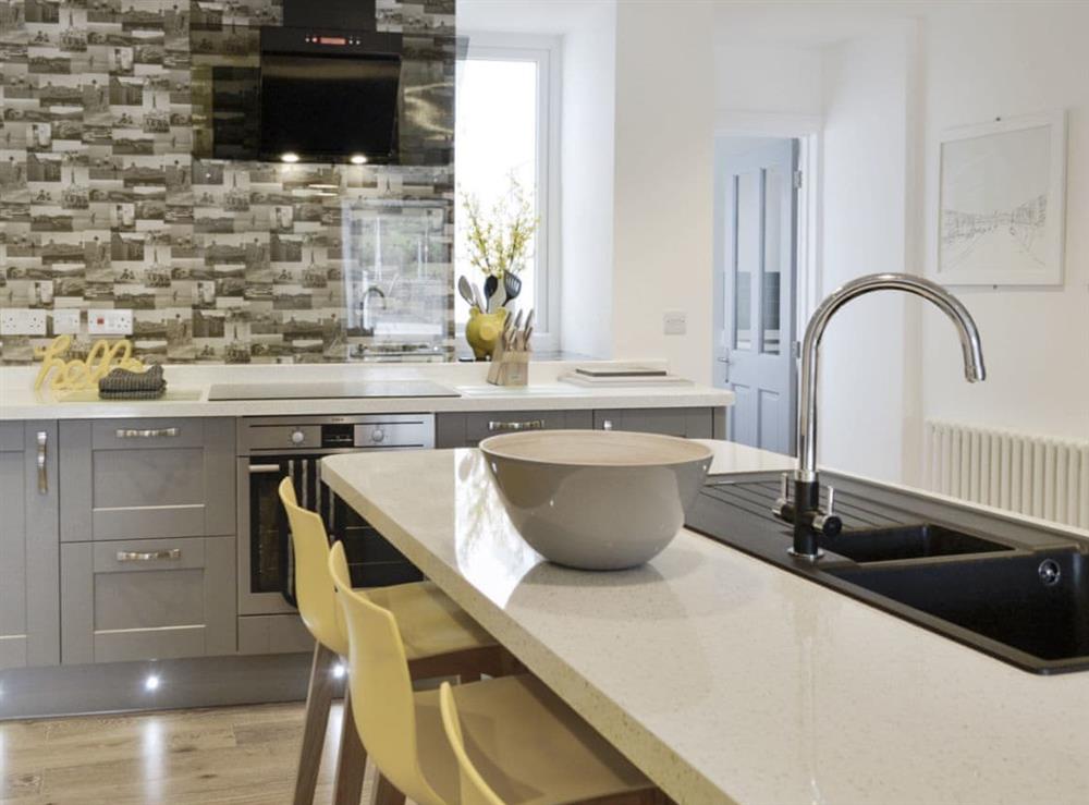 Well-equipped modern fitted kitchen at Blue Beach House in Ilfracombe, Devon