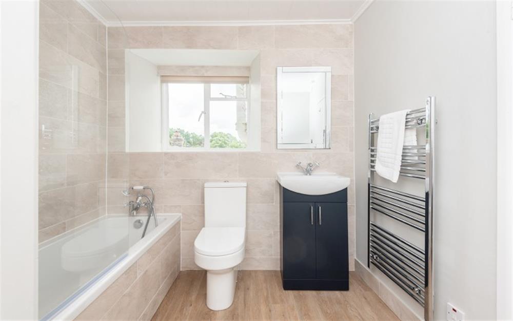 The new bathroom has a comfortable bath with shower over at Blue Cottage in Feock