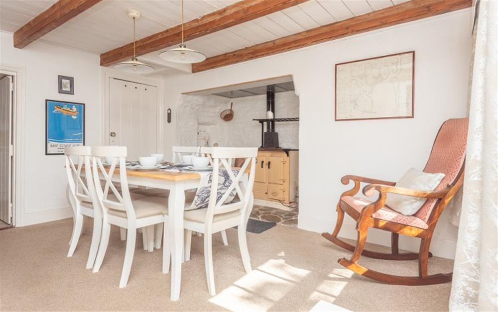 With the front door behind you, you'll enter the spacious dining room at Blue Cottage in Feock
