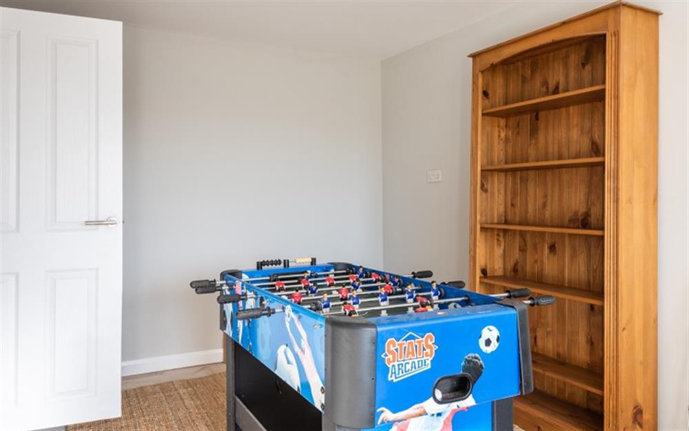 The play room with table football and dart board at Blue Shores in Thurlestone