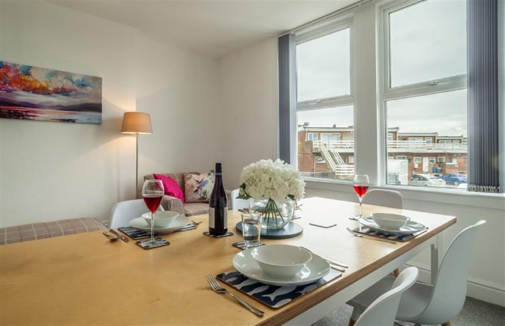 First floor: Plenty of room for entertaining in the dining room at Blue Skies Apartment, Hunstanton