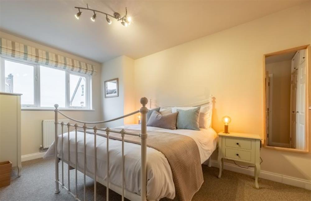 First floor: Master bedroom with double bed at Blue Sky, Wells-next-the-Sea