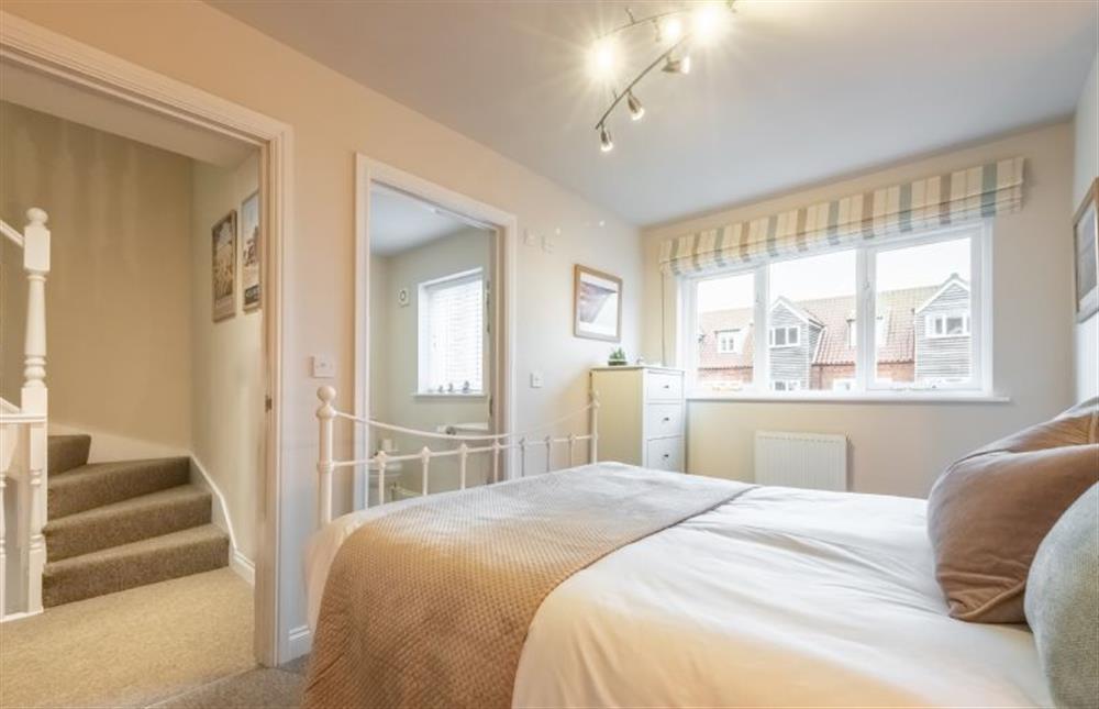 First floor: Master bedroom with en-suite shower room at Blue Sky, Wells-next-the-Sea