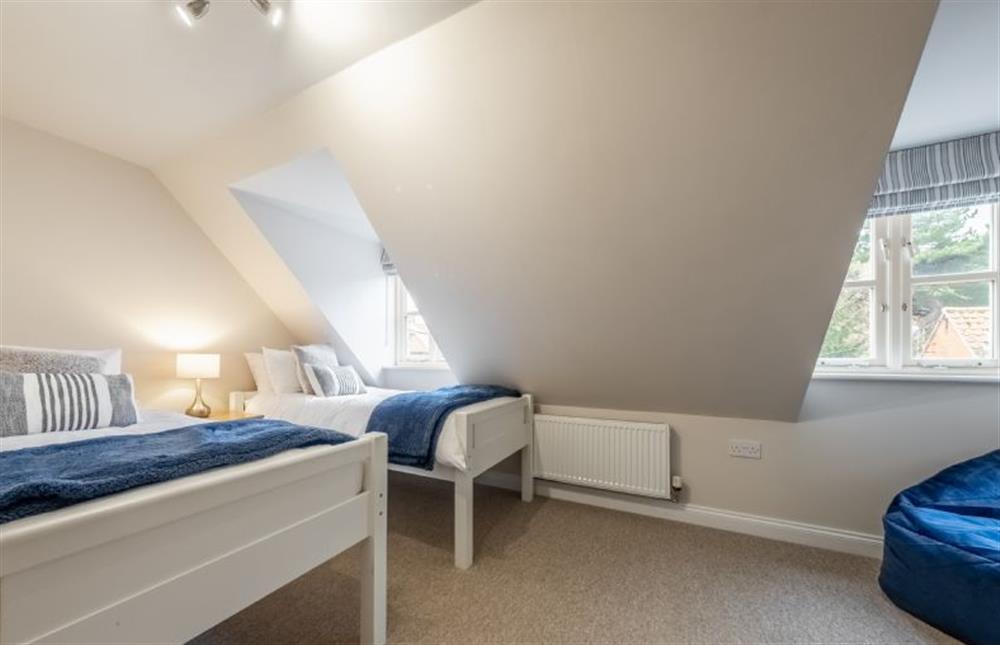 Second floor: Bedroom three with full-size twin beds at Blue Sky, Wells-next-the-Sea