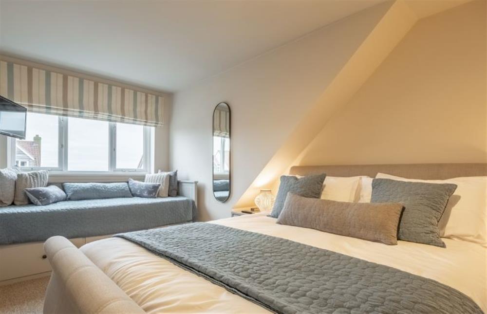 Second floor: Bedroom two with wall-mounted television at Blue Sky, Wells-next-the-Sea
