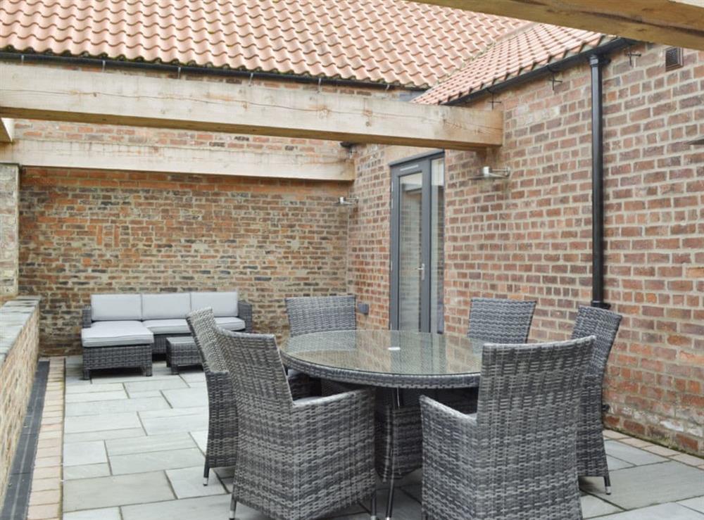 High quality outdoor furniture on paved patio at Bluebell Barn in Dunnington, near York, North Yorkshire