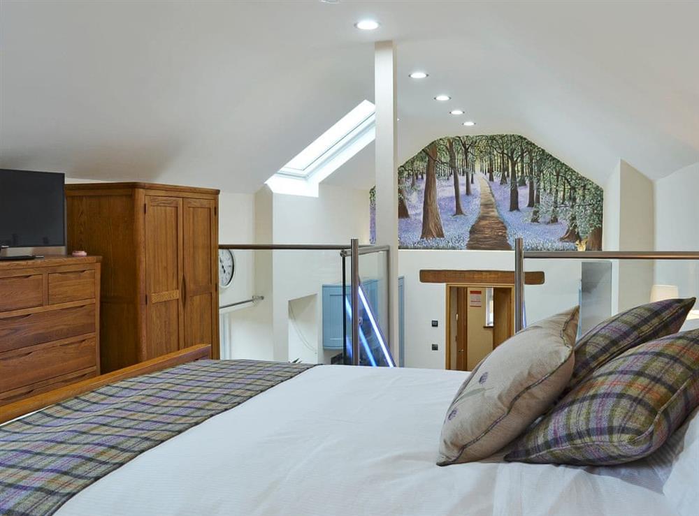 Romantic galleried with bedroom kingsize bed (photo 3) at Bluebell Barn in Okehampton, Devon