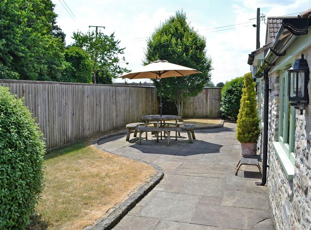 Peaceful patio with garden furniture at Bluebell Cottage in Bristol, Avon