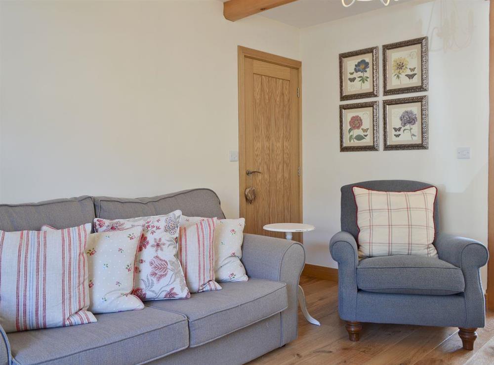 Comfy seating in living room at Bluebell Cottage in Burton in Lonsdale, near Ingleton, North Yorkshire
