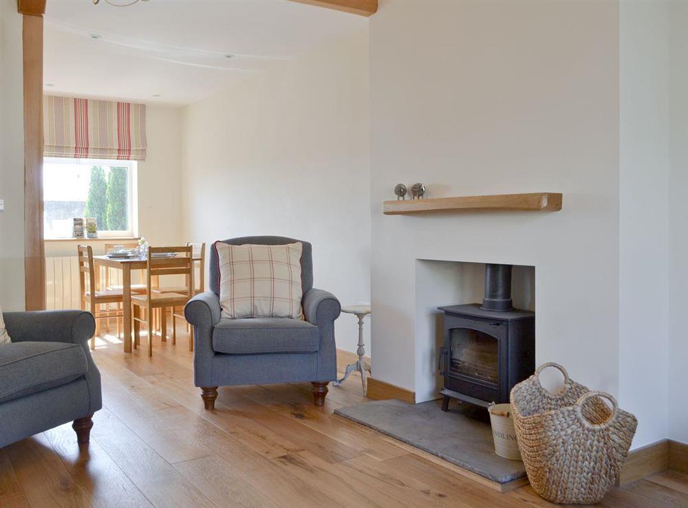 Living room with open aspect to kitchen diner at Bluebell Cottage in Burton in Lonsdale, near Ingleton, North Yorkshire